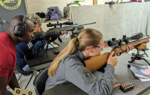 Precision shooting session focusing on firearm safety and handling