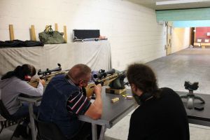 Precision shooting session focusing on firearm safety and handling